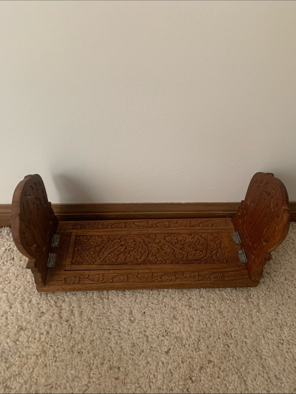 Vintage hand carved expanding book rack.